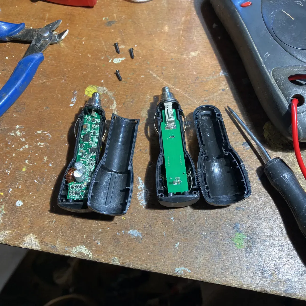 Opened up on the workbench: FuelMaster's real conditioning board next to a junk LED fuel chip