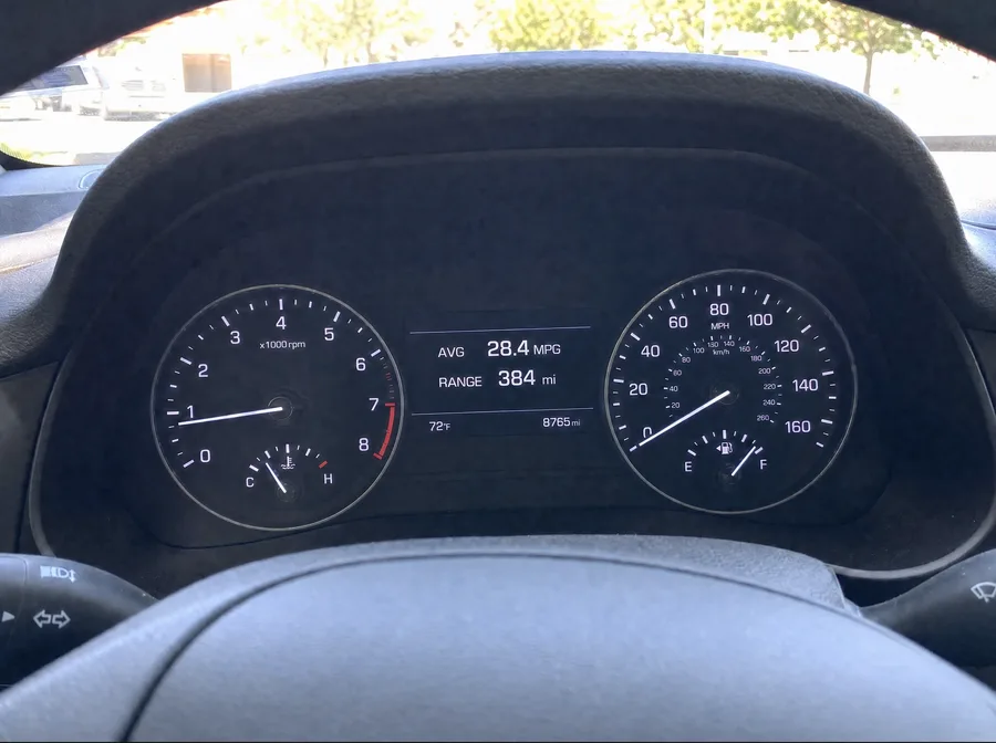 Car trip computer reading 28.4 MPG before FuelMaster